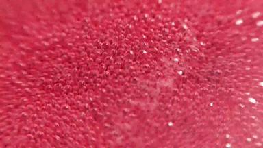 树莓糖浆粉红色的背景冒泡泡沫树莓